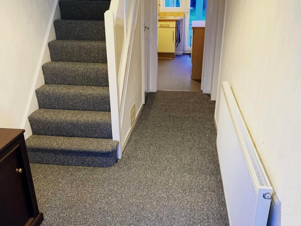 Grey carpet on a hallway and stairs