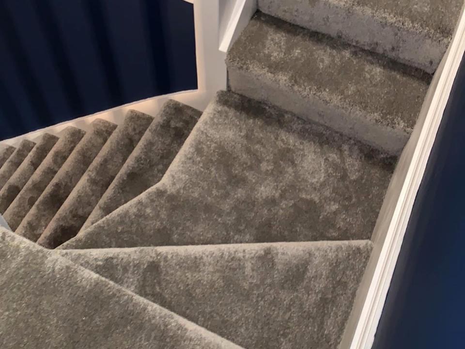 Plush grey carpet on stairs