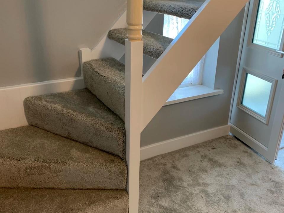 Grey carpet on winder stairs